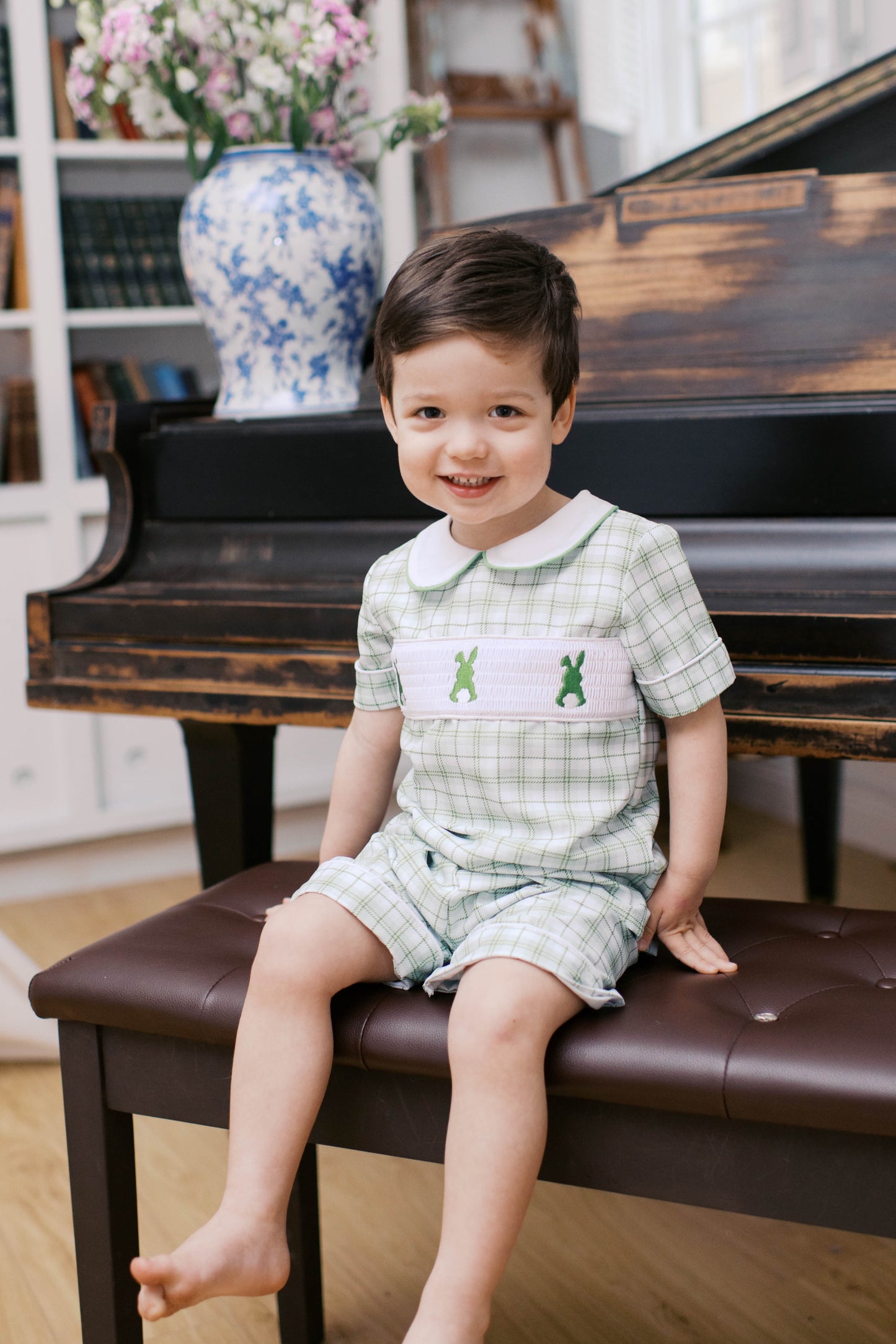 Boys Easter green plaid top and short outfit with smocked bunnies.