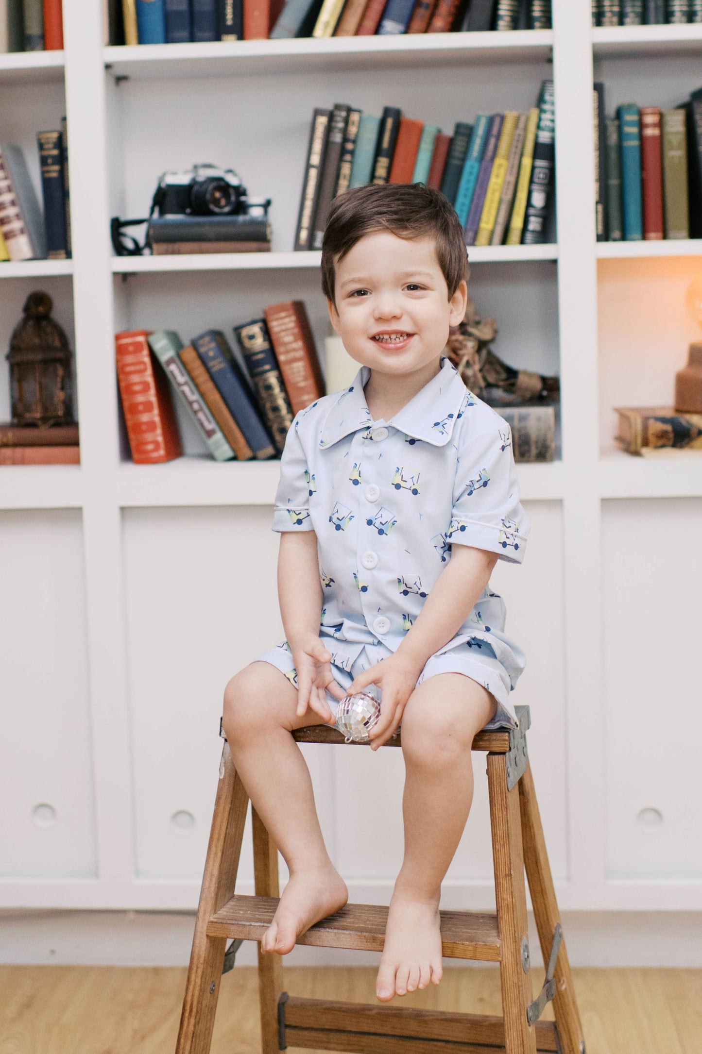 Boys blue golf button down shirt polo with shorts outfit.